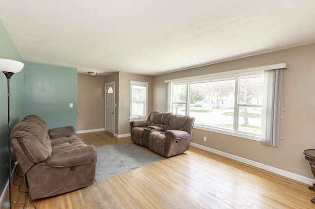 420 17th St S, Moorhead, MN 56560 - living room featuring baseboards and wood finished floors
