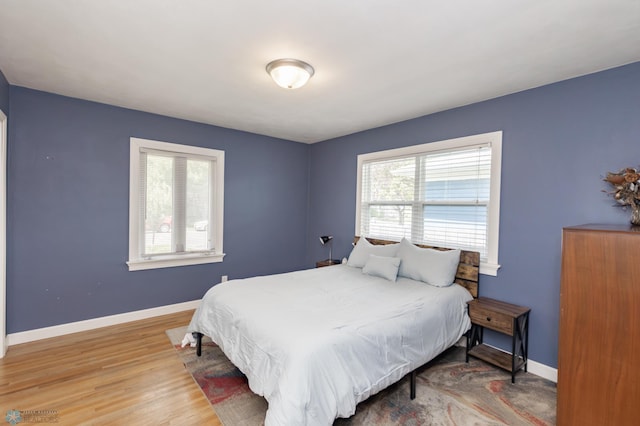 420 17th St S, Moorhead, MN 56560 - bedroom featuring baseboards and wood finished floors