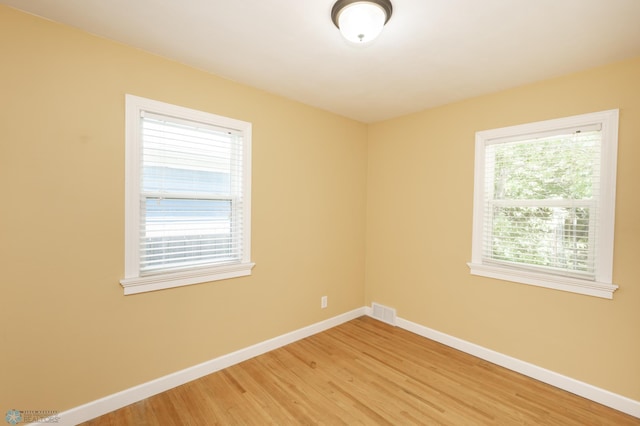 420 17th St S, Moorhead, MN 56560 - empty room with baseboards and light wood-style flooring