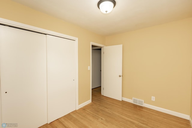 420 17th St S, Moorhead, MN 56560 - unfurnished bedroom with a closet and light wood-type flooring