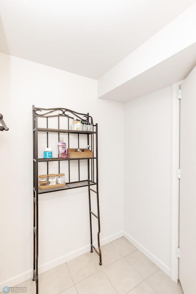 420 17th St S, Moorhead, MN 56560 - unfurnished bedroom featuring baseboards and light tile patterned flooring