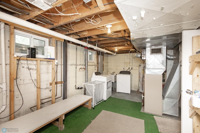 420 17th St S, Moorhead, MN 56560 - unfinished below grade area with electric water heater and washing machine and clothes dryer