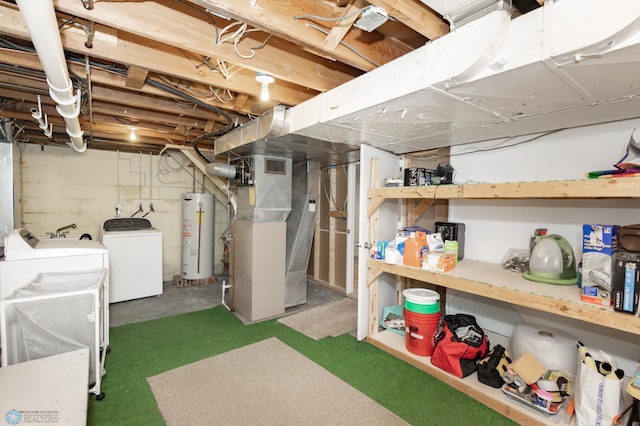 420 17th St S, Moorhead, MN 56560 - unfinished basement featuring water heater, heating unit, and washing machine and dryer