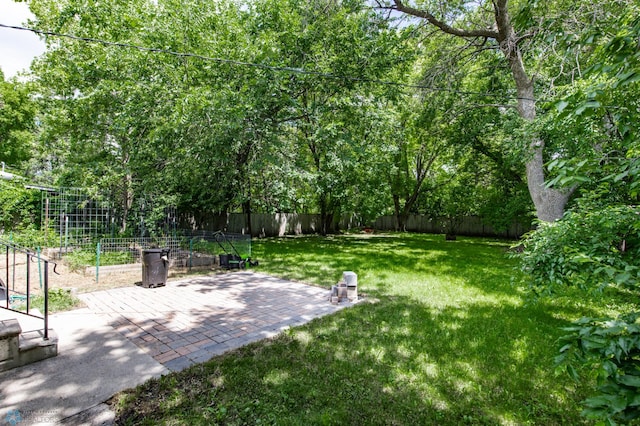 420 17th St S, Moorhead, MN 56560 - fenced backyard featuring a patio area
