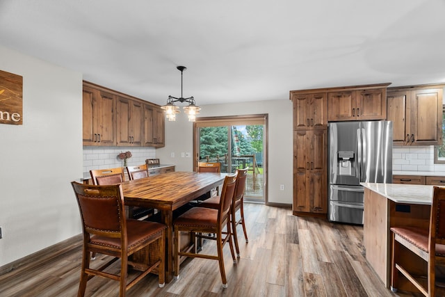 876 162nd St, Hammond, WI 54015 - dining space with a chandelier and wood finished floors