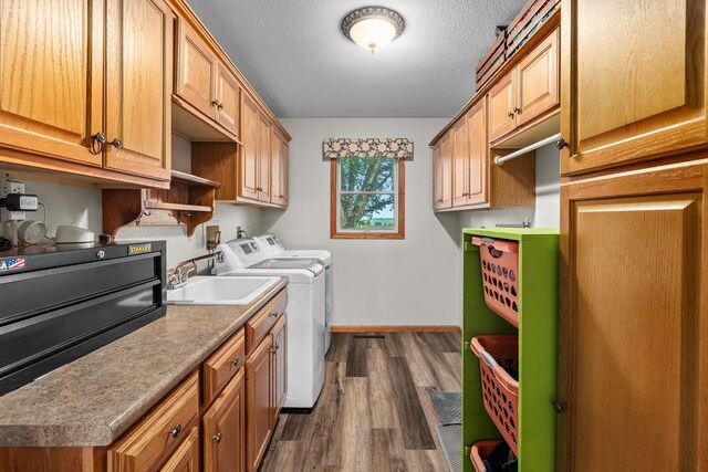 876 162nd St, Hammond, WI 54015 - laundry room with dark wood-type flooring, separate washer and dryer, cabinet space, and a textured ceiling
