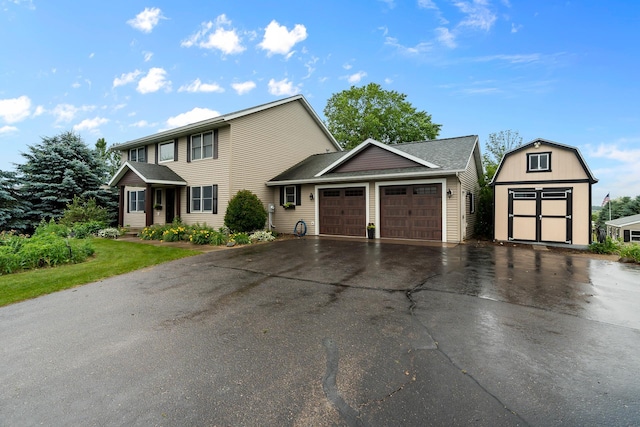 876 162nd St, Hammond, WI 54015 - view of front of property featuring an attached garage, driveway, and a storage unit