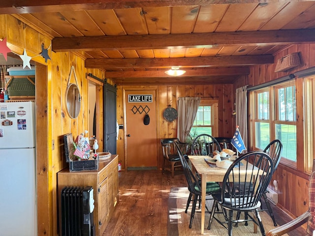 21393 324th Pl, Lakeside Twp, MN 56342 - dining space with radiator heating unit, a wood ceiling with exposed beams, wood walls, and wood-type flooring