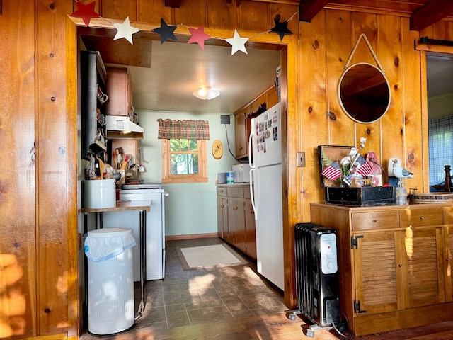21393 324th Pl, Lakeside Twp, MN 56342 - kitchen featuring freestanding refrigerator, extractor fan, wooden walls, brown cabinetry, and stove