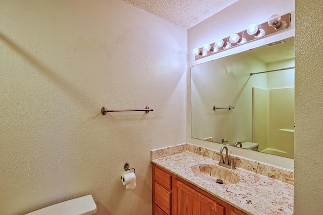 343 Perch Ln, Winsted, MN 55395 - bathroom with a textured ceiling, vanity, and a shower