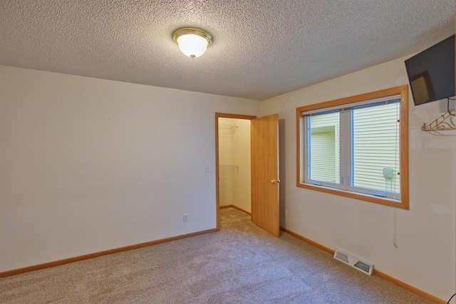 343 Perch Ln, Winsted, MN 55395 - unfurnished room featuring light colored carpet and a textured ceiling