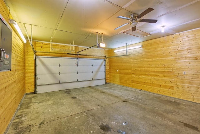 343 Perch Ln, Winsted, MN 55395 - garage with wooden walls and a garage door opener