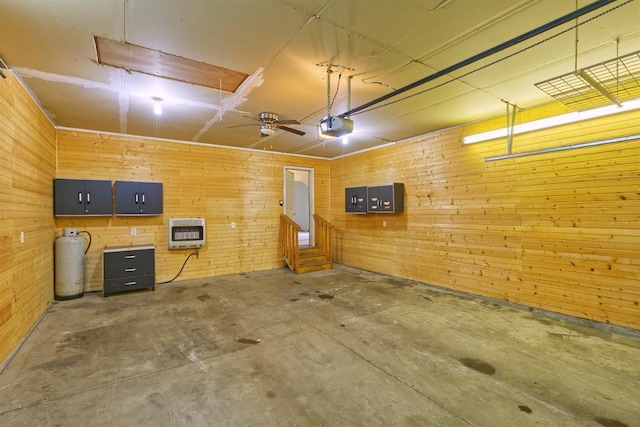 343 Perch Ln, Winsted, MN 55395 - spare room featuring heating unit, concrete floors, and wood walls