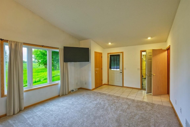 343 Perch Ln, Winsted, MN 55395 - unfurnished bedroom featuring light carpet, lofted ceiling, and light tile patterned flooring