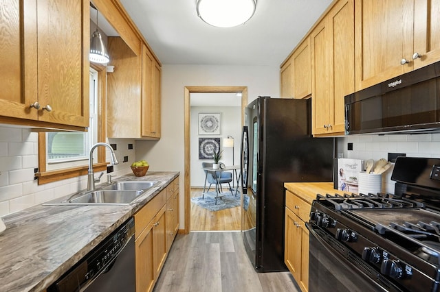 11439 Heights Dr NW, Coon Rapids, MN 55433 - kitchen featuring black appliances, light wood-style floors, tasteful backsplash, and wooden counters