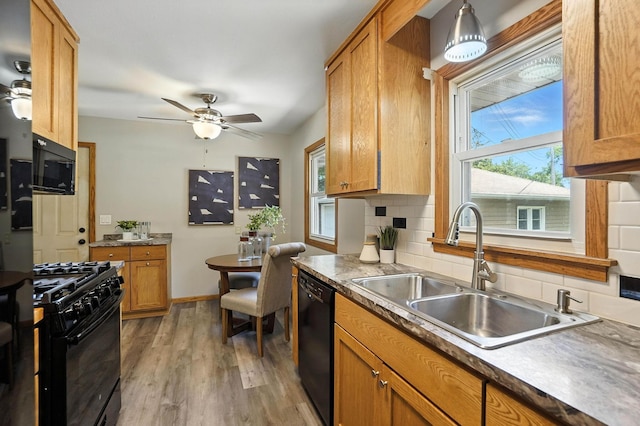 11439 Heights Dr NW, Coon Rapids, MN 55433 - kitchen featuring black appliances, ceiling fan, tasteful backsplash, light wood-style flooring, and brown cabinetry