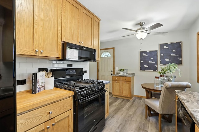 11439 Heights Dr NW, Coon Rapids, MN 55433 - kitchen featuring black appliances, backsplash, light wood finished floors, and a ceiling fan