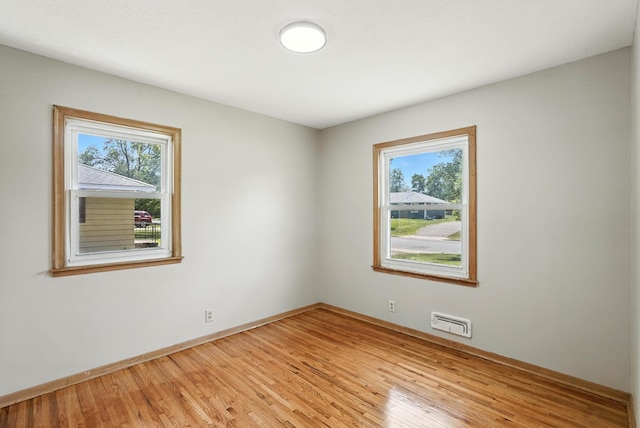 11439 Heights Dr NW, Coon Rapids, MN 55433 - spare room featuring healthy amount of natural light and light wood-style floors