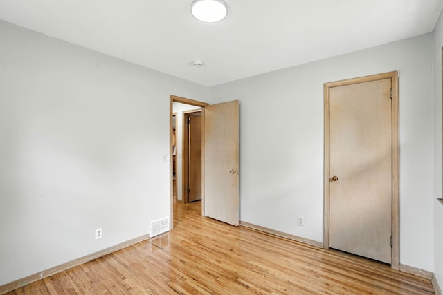 11439 Heights Dr NW, Coon Rapids, MN 55433 - unfurnished bedroom featuring light wood-type flooring and baseboards