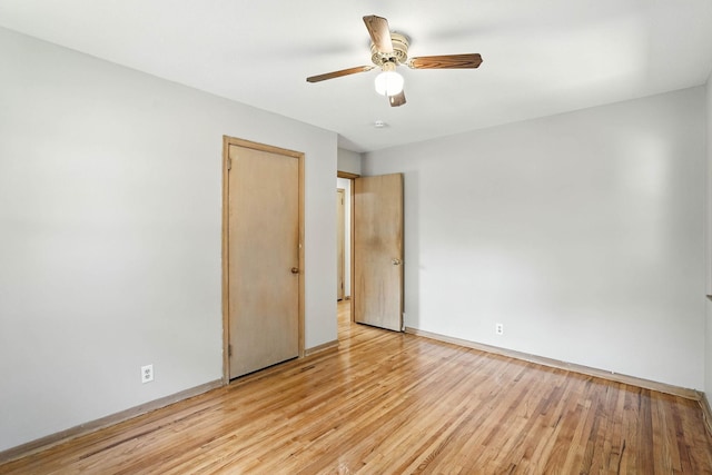 11439 Heights Dr NW, Coon Rapids, MN 55433 - unfurnished room with light wood-type flooring and a ceiling fan