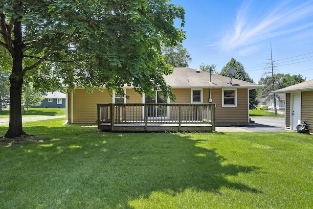 11439 Heights Dr NW, Coon Rapids, MN 55433 - back of house with a wooden deck and a lawn