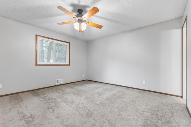 11460 Goldenrod St NW, Coon Rapids, MN 55448 - carpeted spare room featuring a ceiling fan and a textured ceiling