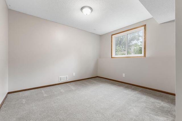 11460 Goldenrod St NW, Coon Rapids, MN 55448 - carpeted empty room featuring baseboards and a textured ceiling