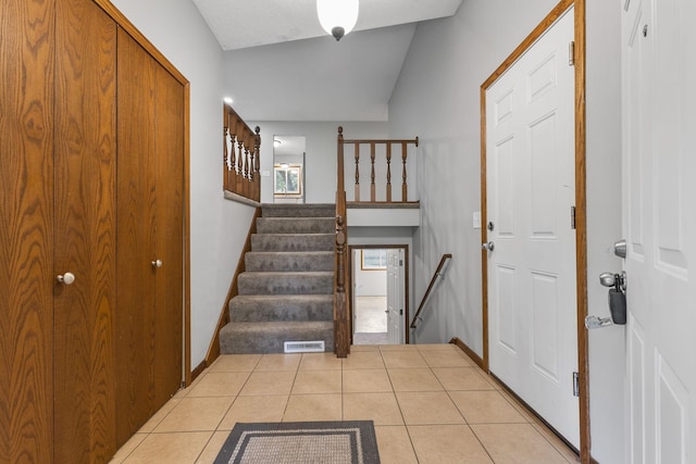 11460 Goldenrod St NW, Coon Rapids, MN 55448 - entrance foyer with light tile patterned flooring and stairs