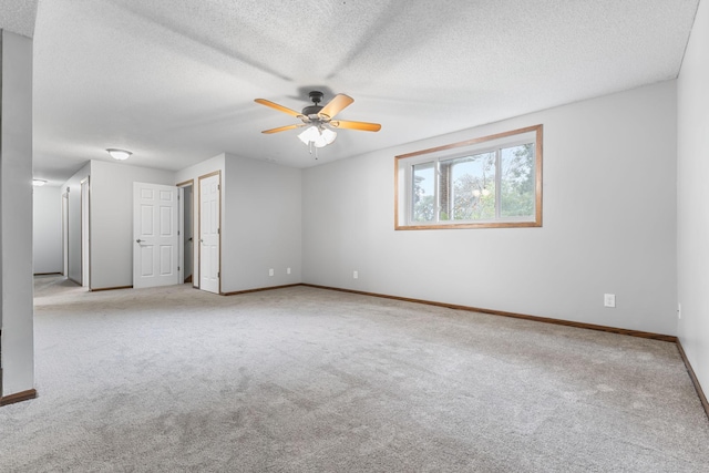 11460 Goldenrod St NW, Coon Rapids, MN 55448 - carpeted empty room featuring ceiling fan and a textured ceiling