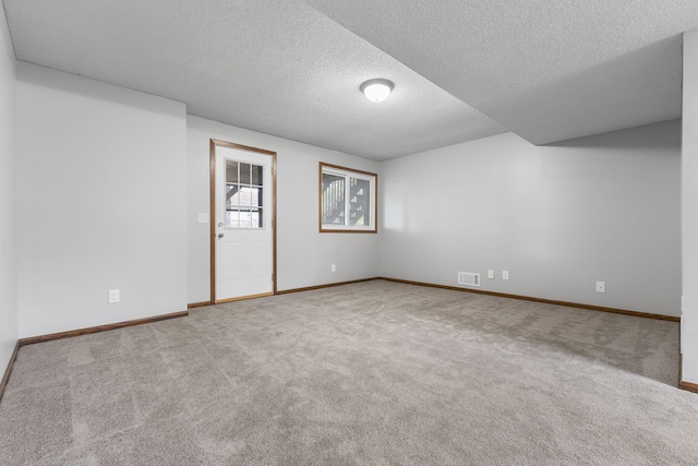 11460 Goldenrod St NW, Coon Rapids, MN 55448 - carpeted empty room featuring a textured ceiling and baseboards