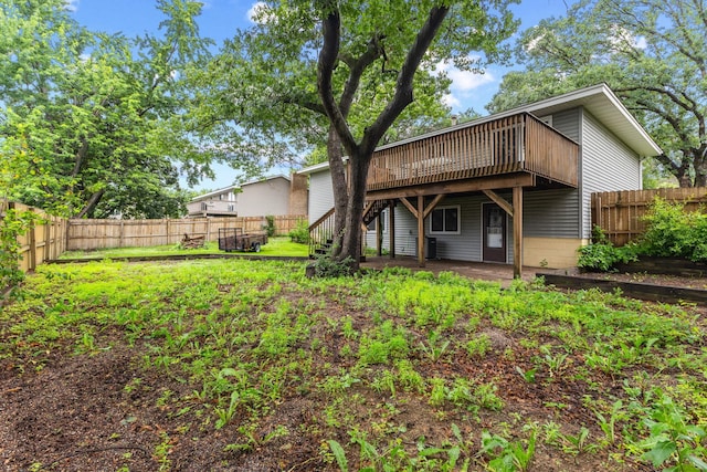 11460 Goldenrod St NW, Coon Rapids, MN 55448 - back of house featuring a wooden deck, a fenced backyard, and stairway