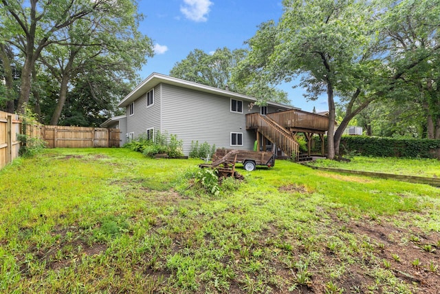 11460 Goldenrod St NW, Coon Rapids, MN 55448 - back of property featuring a wooden deck, a fenced backyard, and stairs