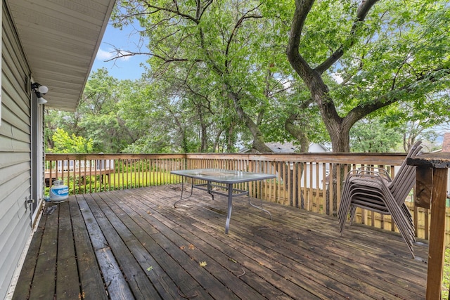 11460 Goldenrod St NW, Coon Rapids, MN 55448 - wooden deck with outdoor dining area