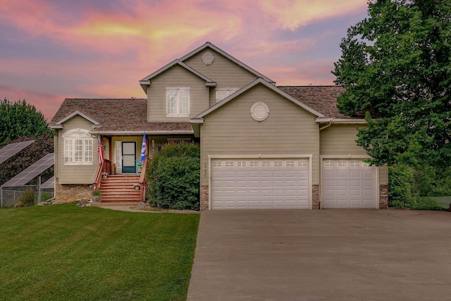 9386 Jennifer Ct, Chisago Lake Twp, MN 55013 - traditional home featuring driveway, a lawn, an attached garage, and covered porch