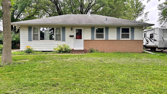 122 Plainview Ave, Mankato, MN 56001 - view of front facade featuring a front lawn, brick siding, and a shingled roof