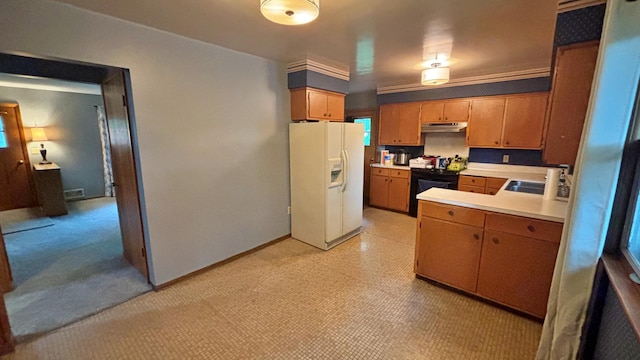122 Plainview Ave, Mankato, MN 56001 - kitchen featuring white refrigerator with ice dispenser, under cabinet range hood, stove, light countertops, and brown cabinetry