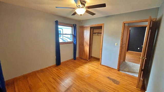 122 Plainview Ave, Mankato, MN 56001 - unfurnished bedroom featuring light wood-type flooring, a closet, and ceiling fan