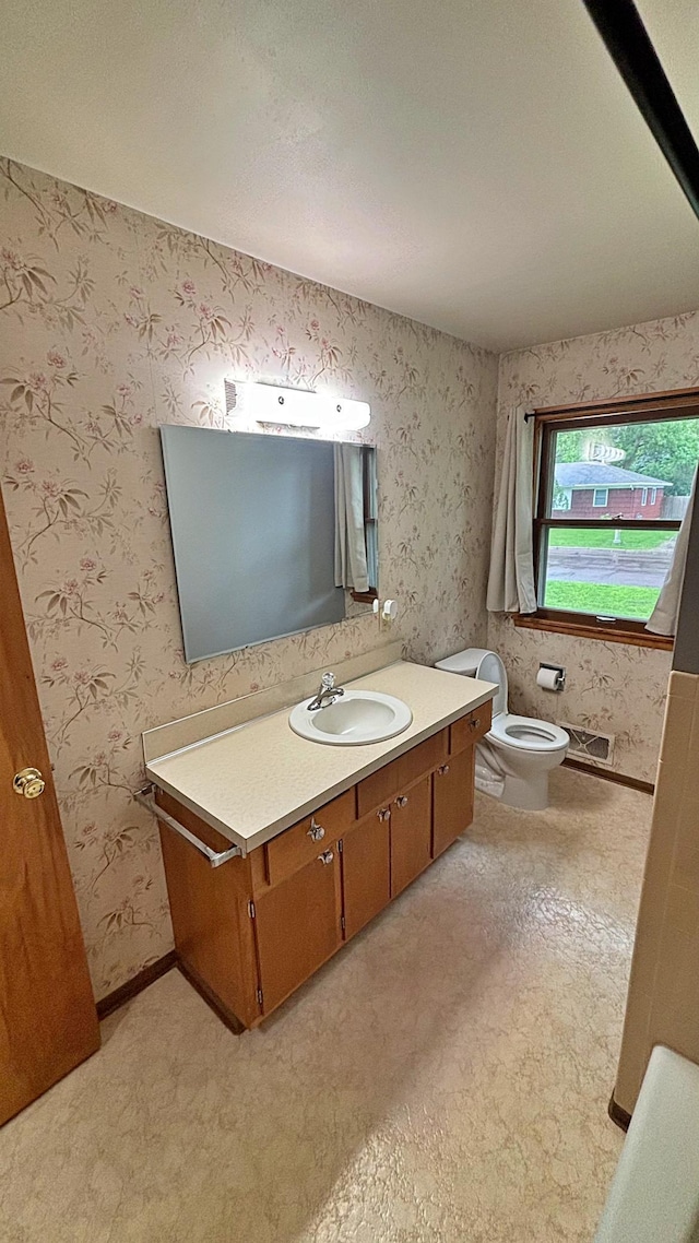 122 Plainview Ave, Mankato, MN 56001 - bathroom featuring vanity and wallpapered walls