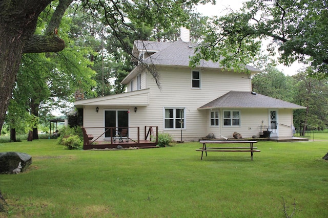 34497 Quiken Rd, Motley, MN 56466 - rear view of property featuring a wooden deck, a chimney, a lawn, and roof with shingles