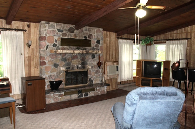 34497 Quiken Rd, Motley, MN 56466 - living room featuring a wood ceiling with exposed beams, wood walls, carpet, a fireplace, and a ceiling fan