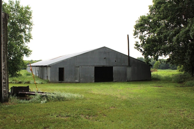 34497 Quiken Rd, Motley, MN 56466 - view of pole building featuring a yard