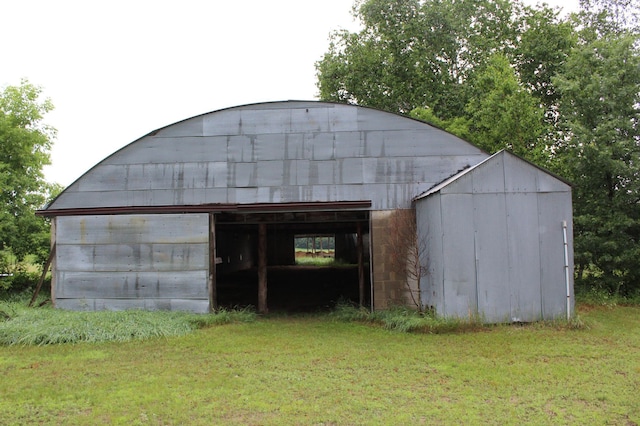 34497 Quiken Rd, Motley, MN 56466 - view of pole building with a yard