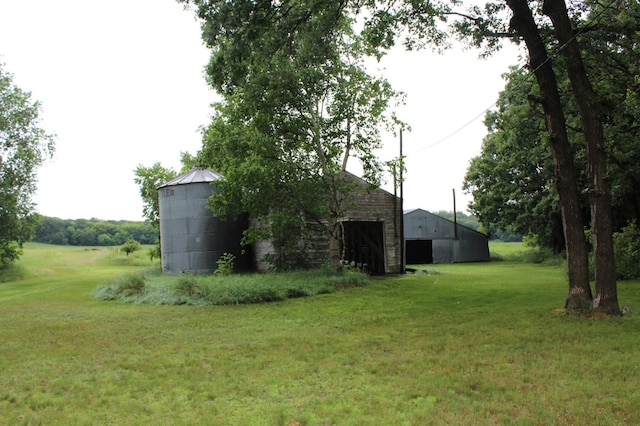 34497 Quiken Rd, Motley, MN 56466 - view of green lawn with an outbuilding and a detached garage