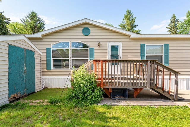 108 Hilton Ct, Mankato, MN 56001 - rear view of property with a wooden deck, a lawn, and a shed