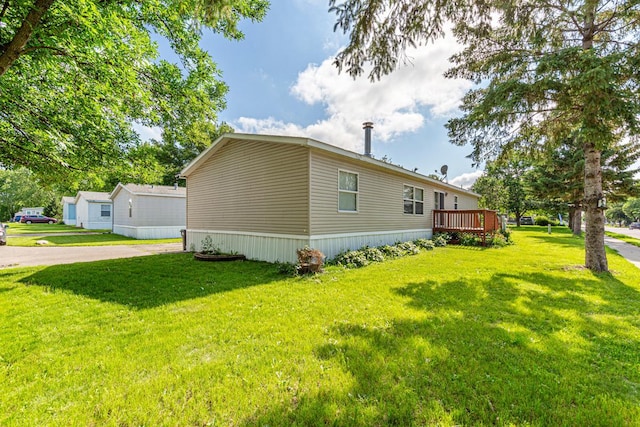 108 Hilton Ct, Mankato, MN 56001 - view of home's exterior featuring a yard, driveway, and a deck
