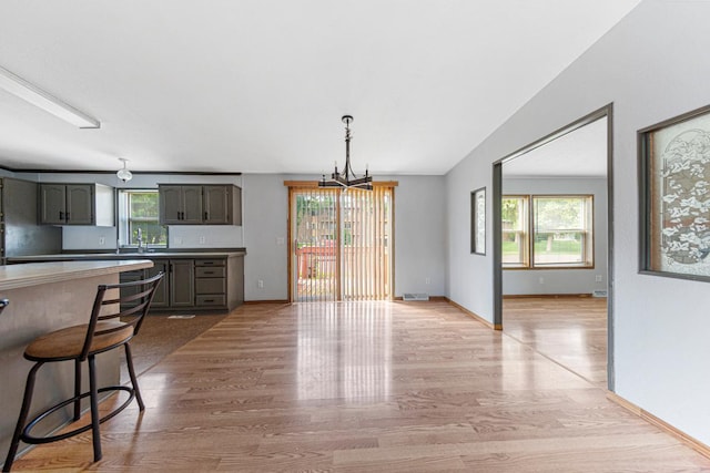 108 Hilton Ct, Mankato, MN 56001 - kitchen featuring a chandelier and light wood finished floors