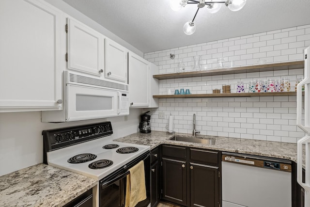 66 9th St E Unit 1712, Saint Paul, MN 55101 - kitchen with white appliances, backsplash, white cabinets, open shelves, and a textured ceiling