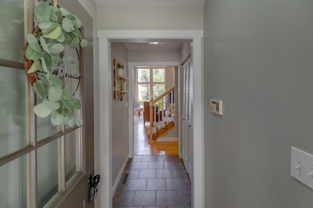 20428 Pheasant Trl, Brainerd, MN 56401 - hallway featuring stone tile flooring and stairs