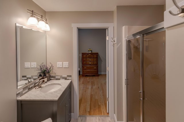 20428 Pheasant Trl, Brainerd, MN 56401 - full bath with vanity, a stall shower, and wood finished floors