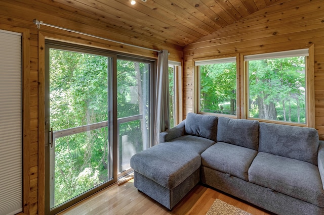 20428 Pheasant Trl, Brainerd, MN 56401 - living area with vaulted ceiling, wood walls, light wood finished floors, and wood ceiling